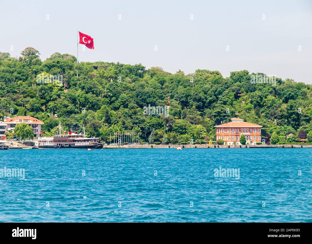 Istanbul / Turkey - Turkish flag, ship and residential buildings at ...