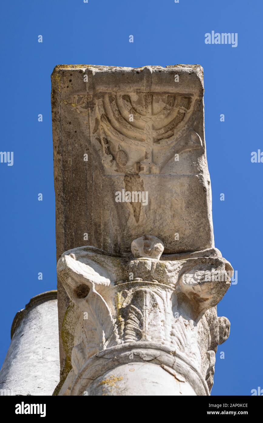 Rome. Italy. Ostia Antica. Remains of the Synagogue, ca. mid 1st century AD. Detail of a seven-branched candelabrum (menorah) relief on a column of th Stock Photo