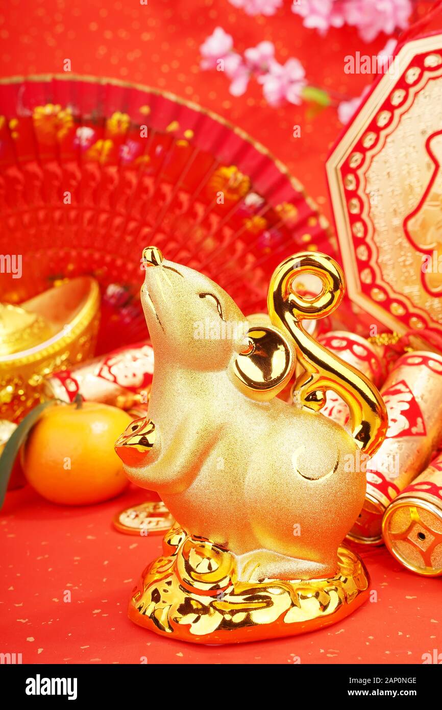 Tradition Chinese golden rat statue rat,2020 is year of the rat,Chinese characters on gold ingot translation: good bless for money. Stock Photo