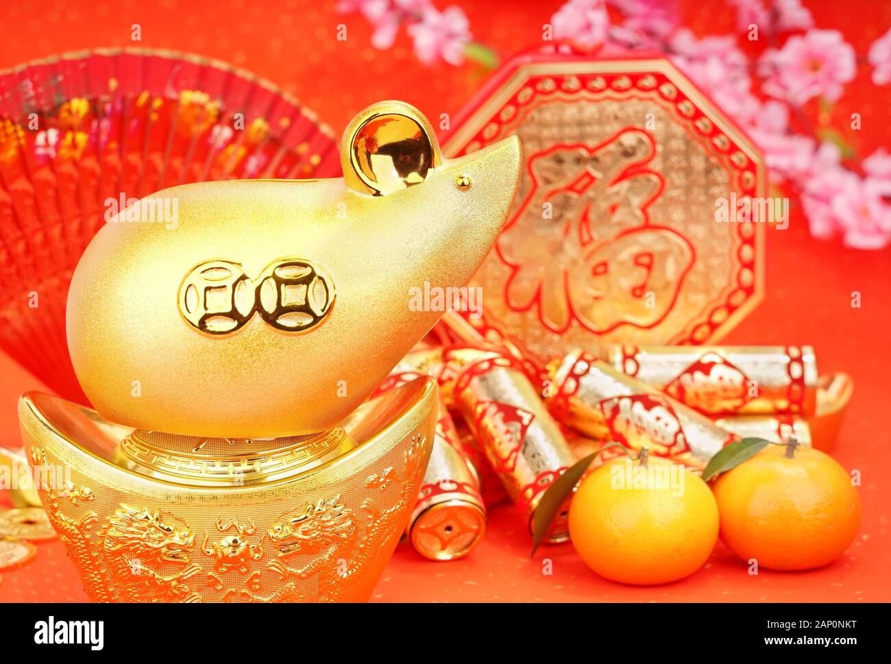 Tradition Chinese golden rat statue rat,2020 is year of the rat,Chinese characters on gold ingot translation: good bless for money. Stock Photo