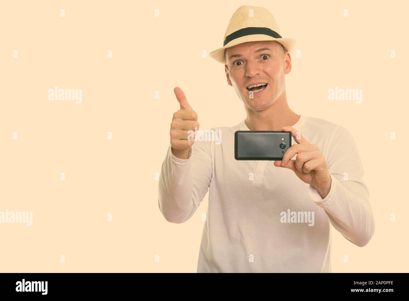 Studio shot of young handsome tourist man ready for vacation isolated ...