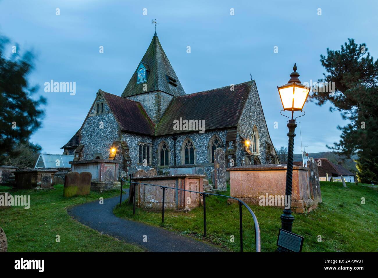 Night falls at St Margaret's church in Ditchling village, East Sussex, England. Stock Photo