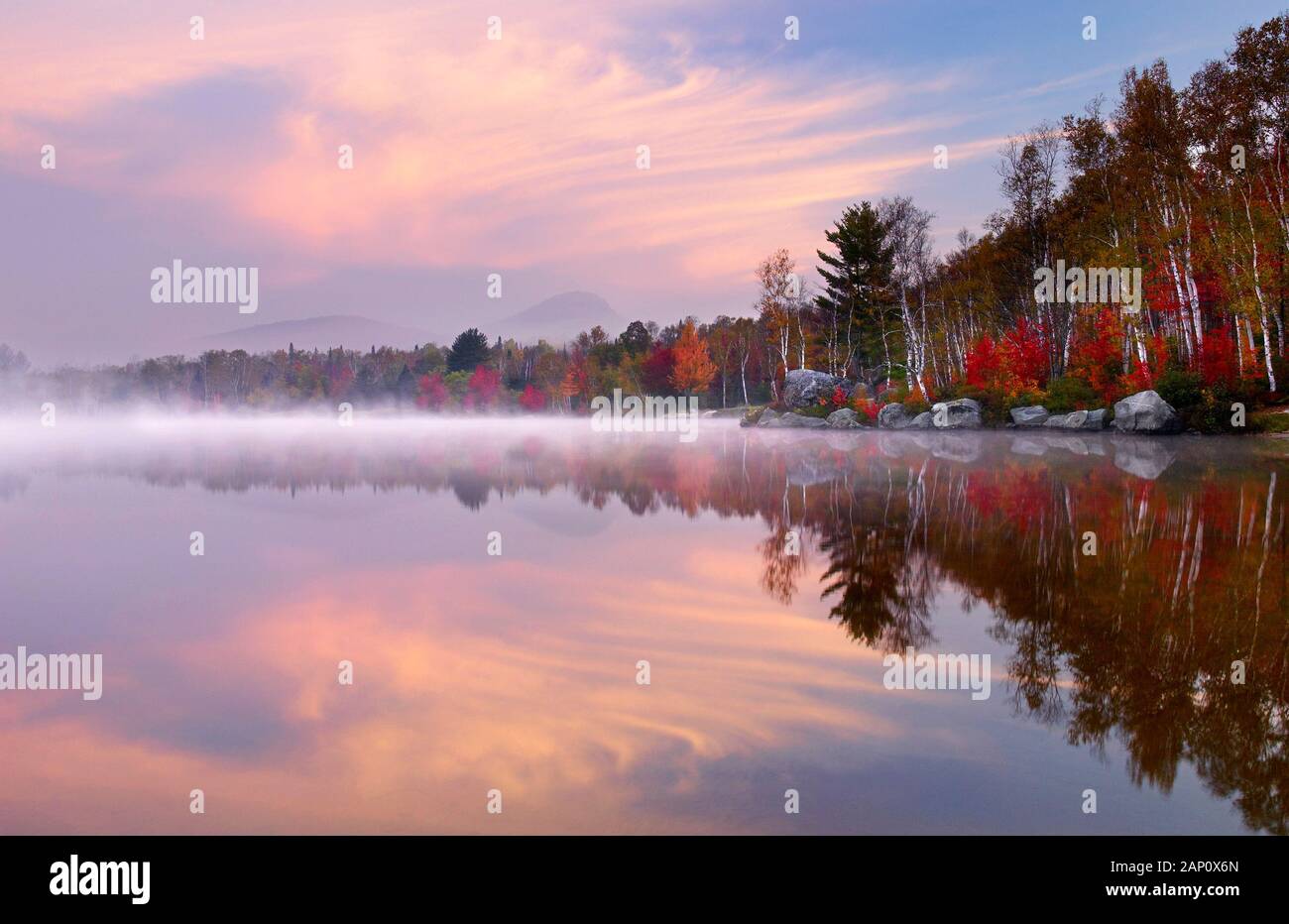 Misty sunrise over Groton Pond in Autumn, Vermont, New England, USA Stock Photo
