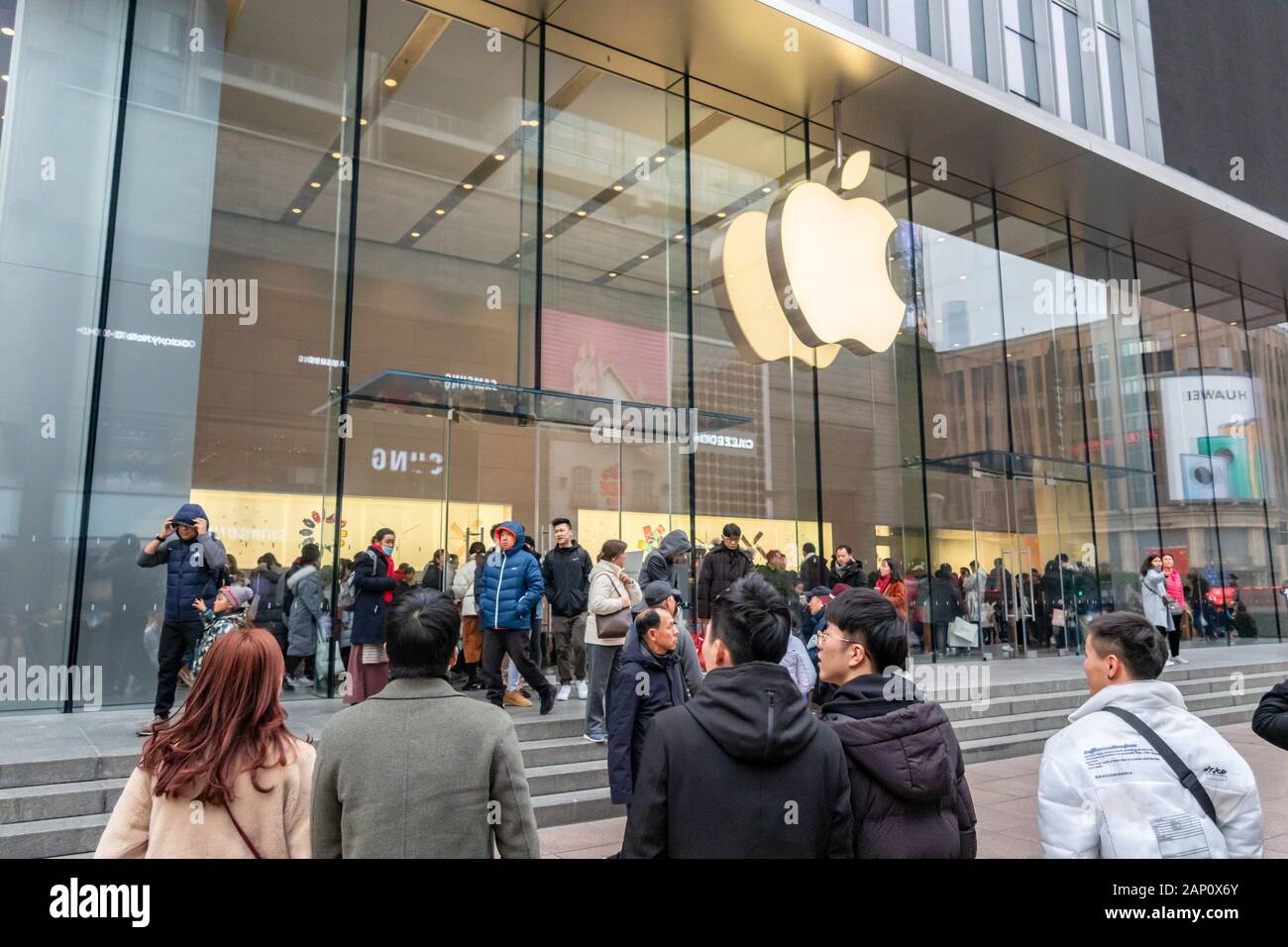 Customers crowd the Apple Store on the Nanjing Road shopping street in Shanghai, China on January 18th, 2020. Stock Photo