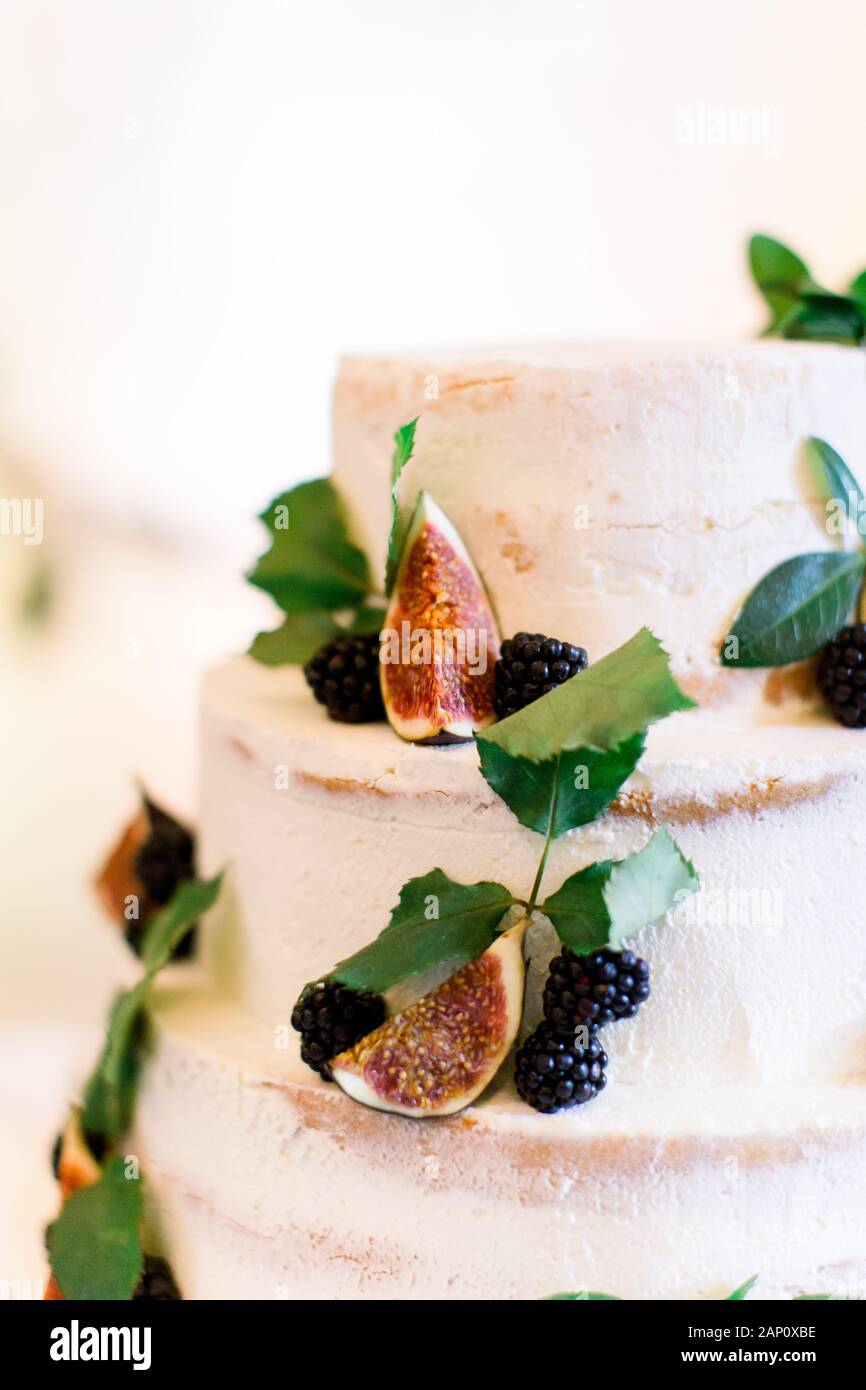 Delicious Rustic Wedding Cake With Figs And Berries Stock Photo