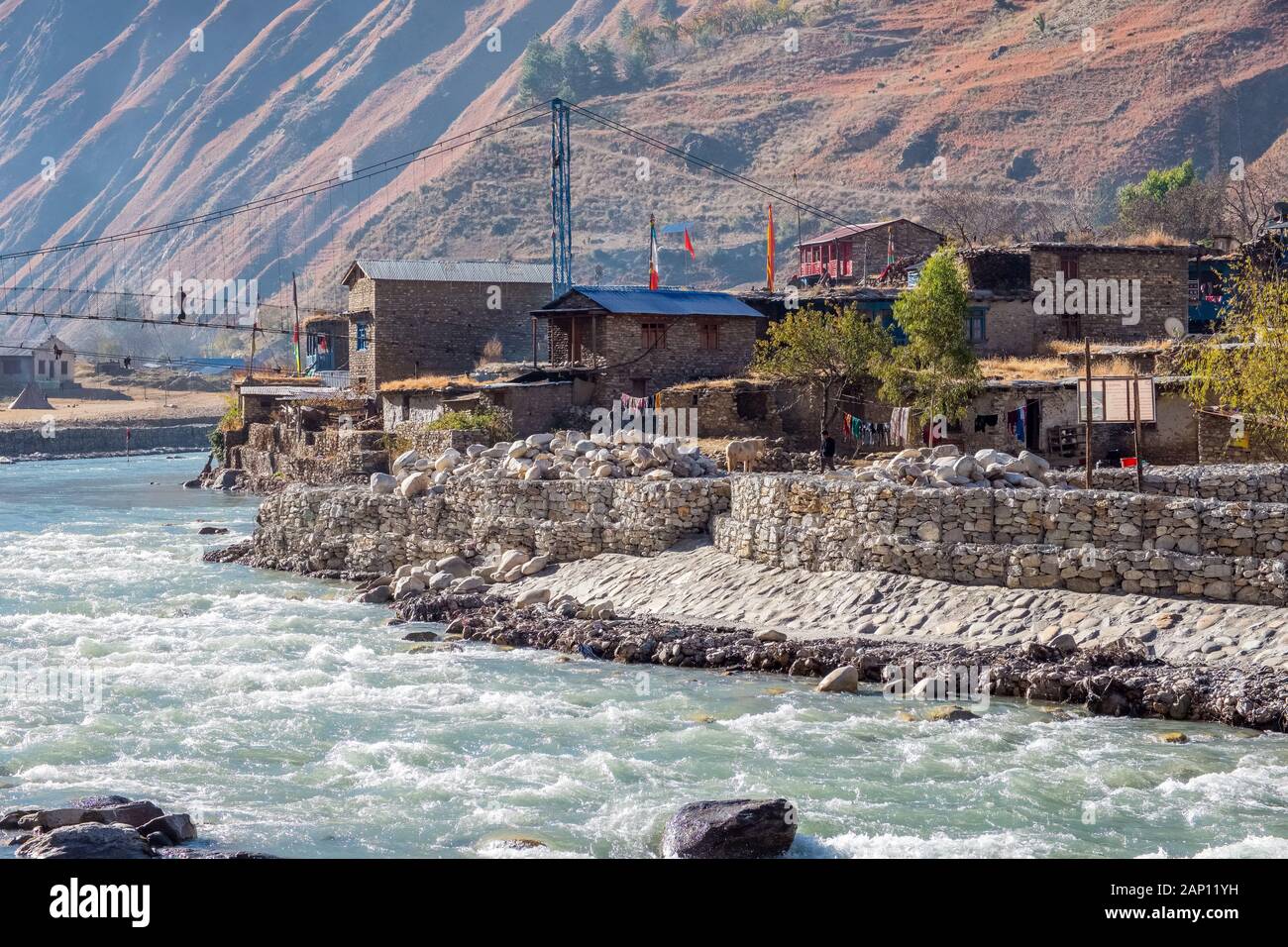 River banks reinforced to prevent flooding / erosion at The village of Dunai in Dolpo, Nepal Stock Photo