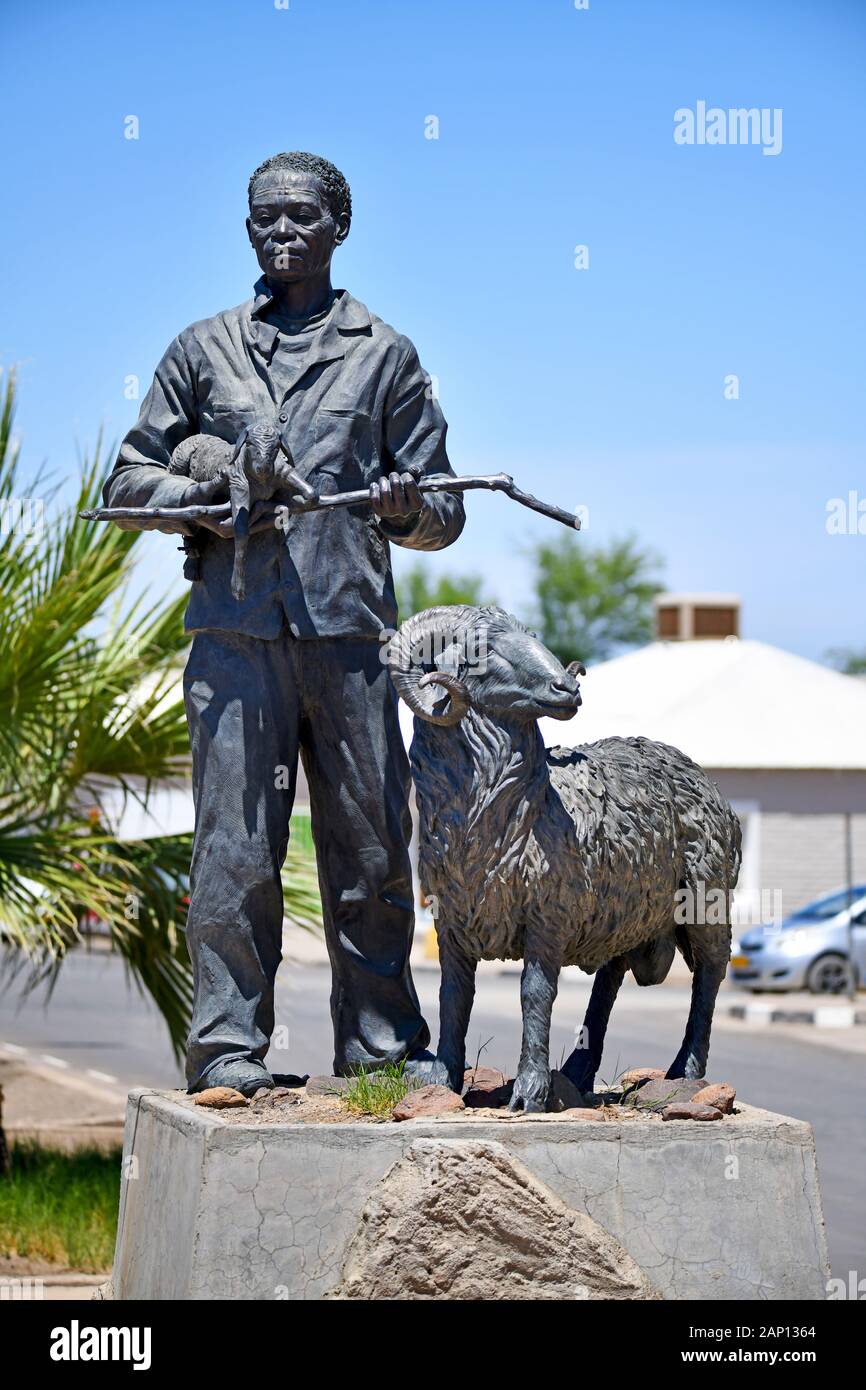 Bronze Karakul statue in Keetmanshoop, taken on 22.02.2019, it shows a Nama shepherd with a newborn lamb in his arms and a ram. This statue is said to symbolize the Namibian Karakul sheep industry. The sculpture created by the Namibian artist Christina Salvoldi was unveiled on September 13, 2007, the 100th anniversary of the development of the Karakul fur industry in Namibia. Photo: Matthias Toedt/dpa-Zentralbild/ZB/Picture Alliance | usage worldwide Stock Photo