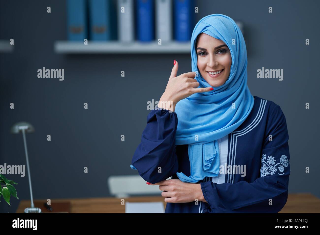 Muslim woman using smartphone Stock Photo