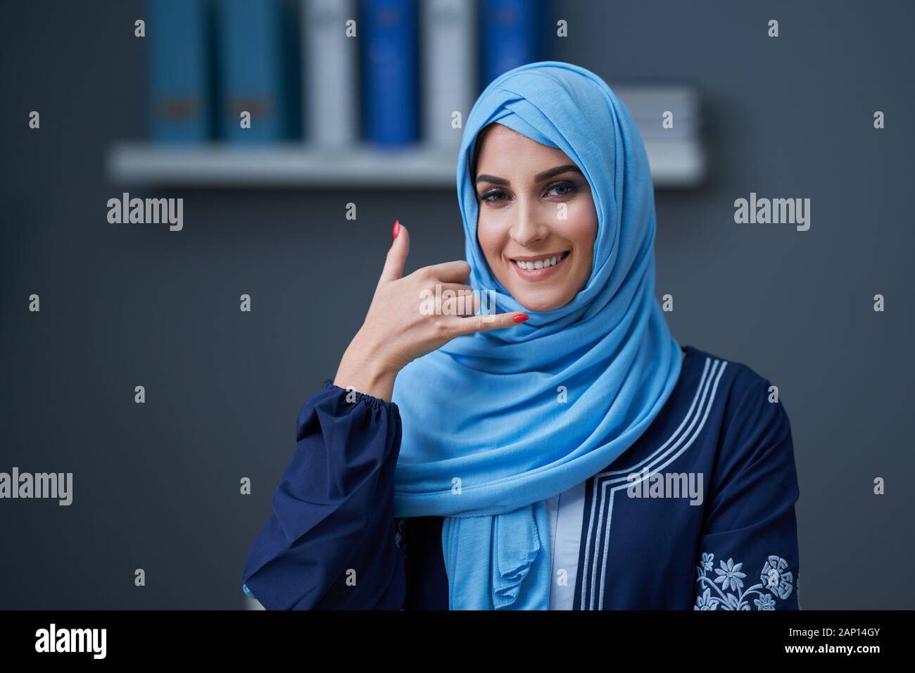 Muslim woman using smartphone Stock Photo