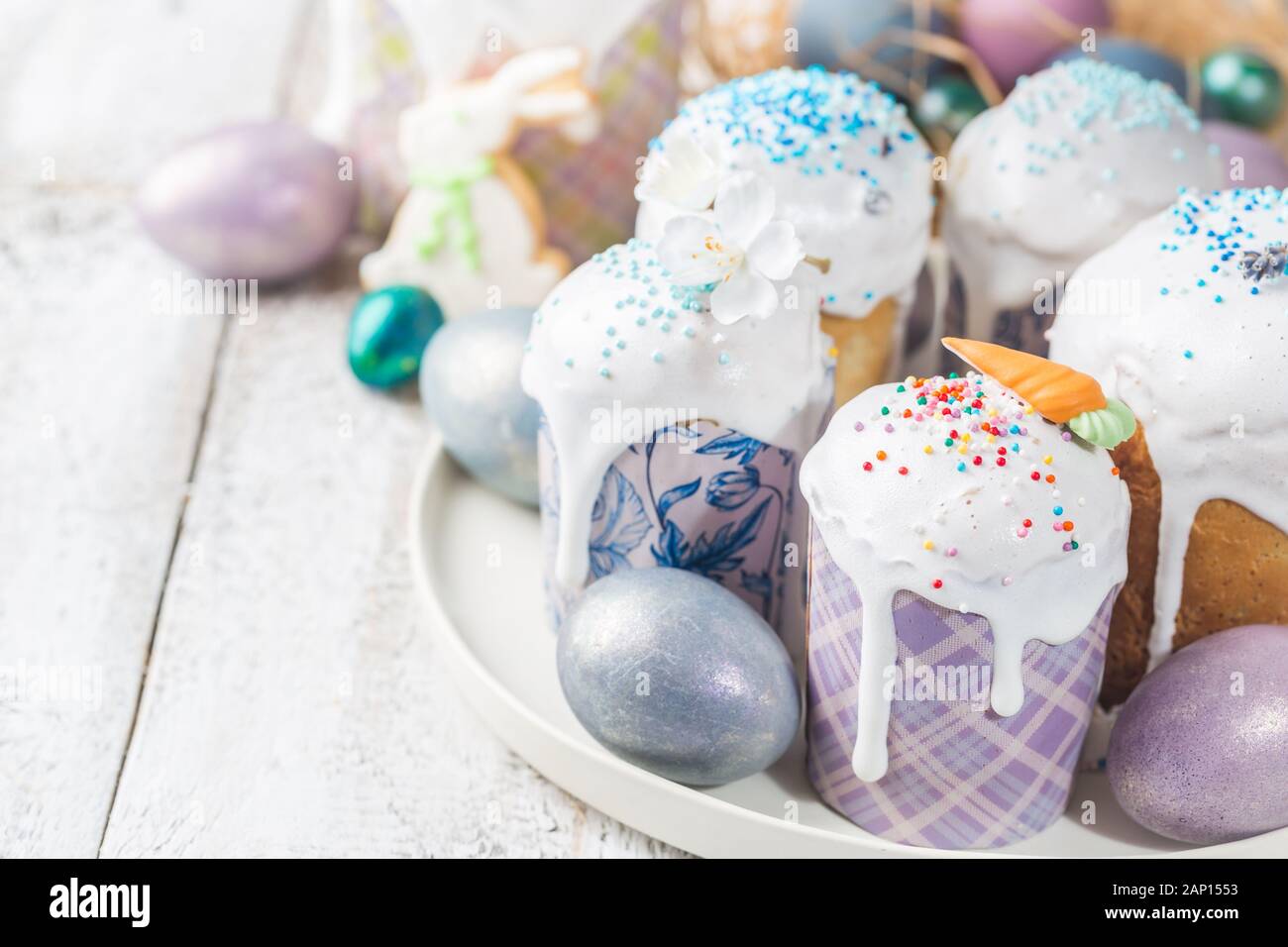 Easter table with Easter cakes and Easter eggs over white background Stock  Photo - Alamy