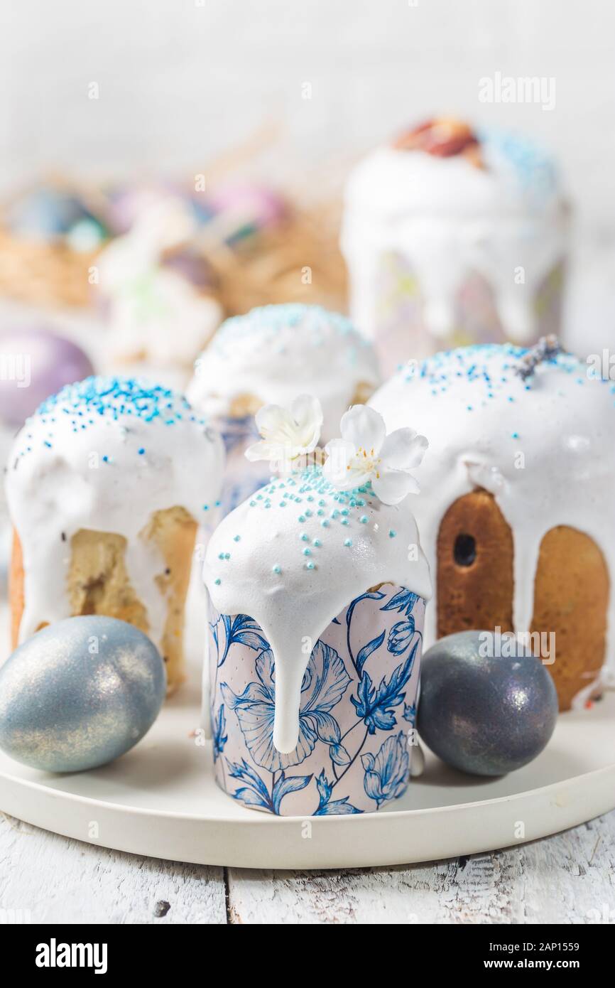 Easter table with Easter cakes and Easter eggs over white background Stock Photo