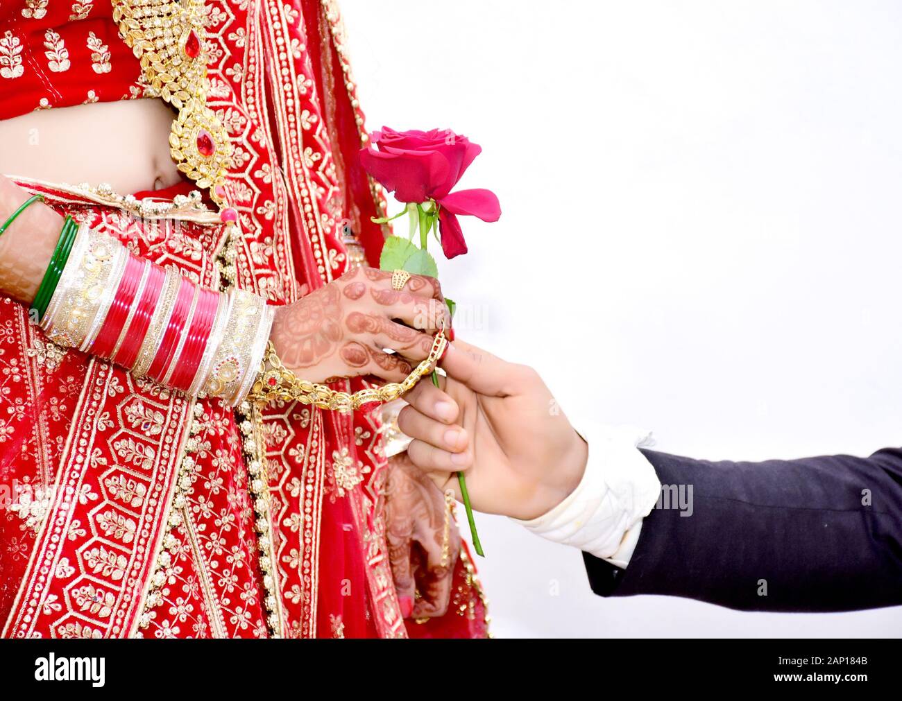 Indian Groom gives Rose flower to bride in wedding Stock Photo Alamy