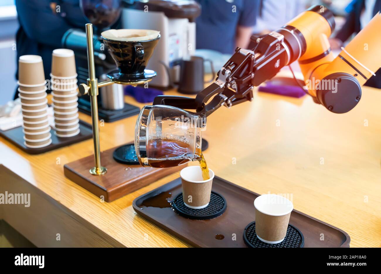 automatic arm preparing coffee in coffee machine Stock Photo