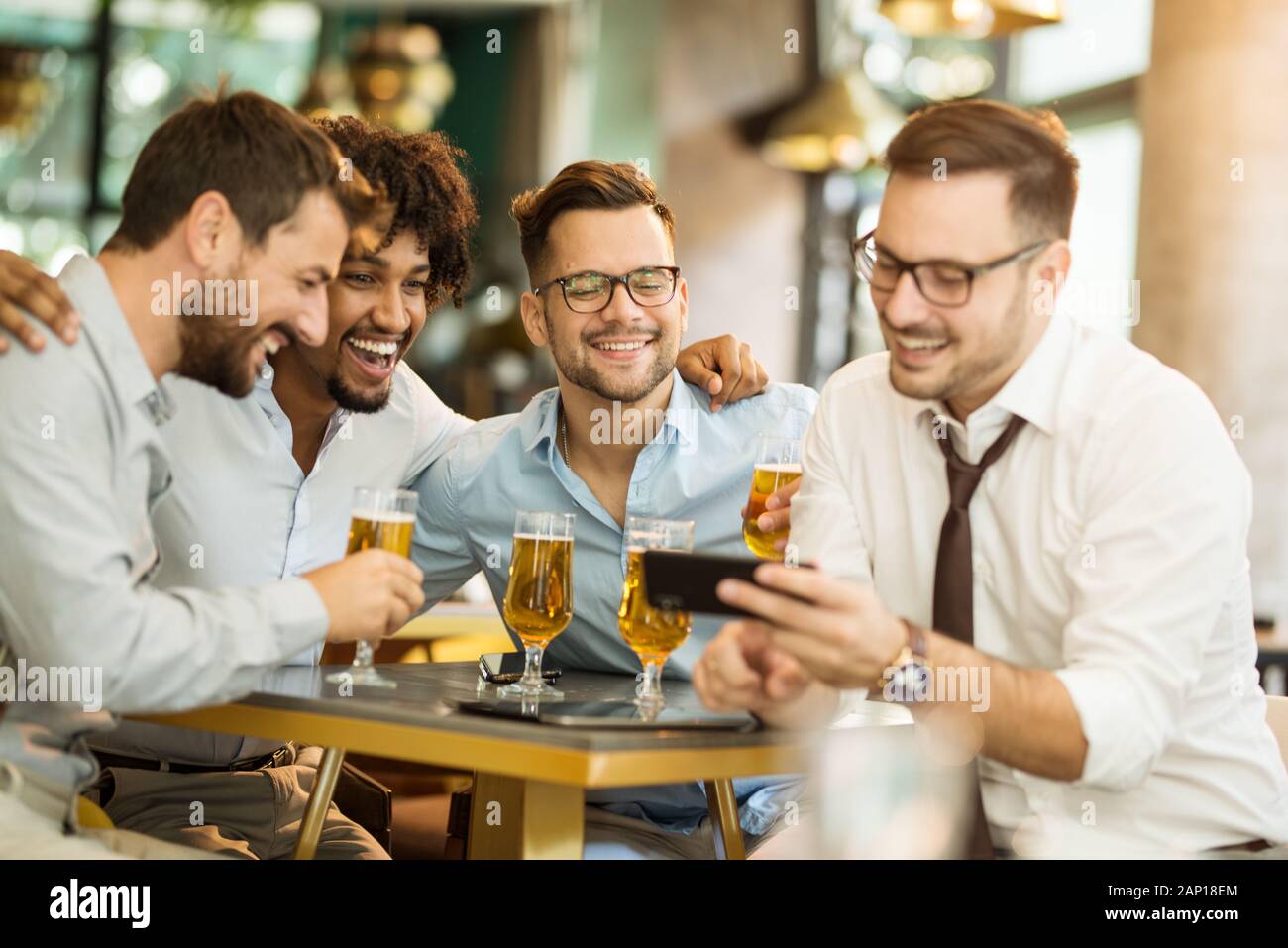 Fun after work with beer. Group businessman drink beer after work Stock Photo