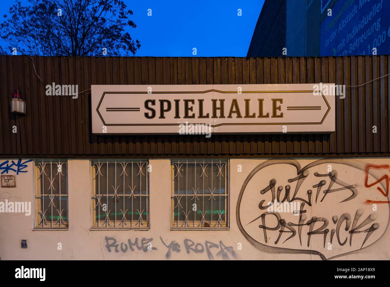 17 January 2020, Saxony-Anhalt, Magdeburg: The lettering 'Spielhalle' on a building with barred windows. Photo: Stephan Schulz/dpa-Zentralbild/ZB Stock Photo