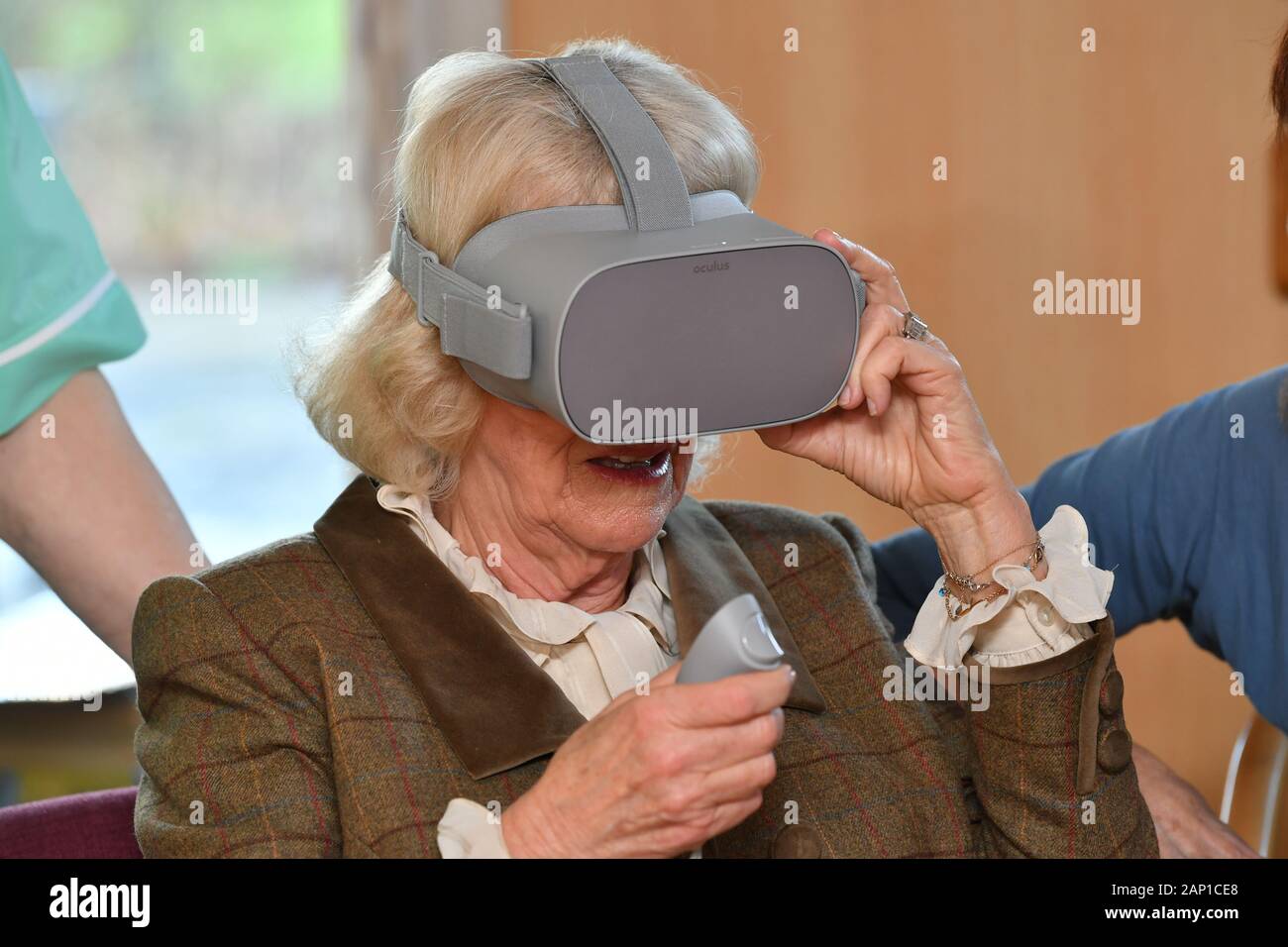 The Duchess of Cornwall trying on a virtual reality headset during a visit to Prospect Hospice in Wroughton, Swindon in celebration of their 40th anniversary year. The headsets are worn by patients to calm them, showing a tranquil woodland scene. Stock Photo