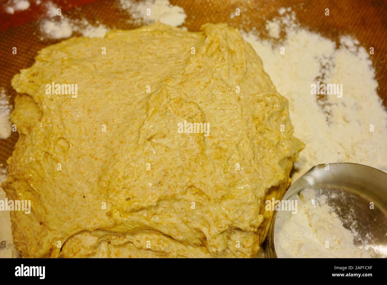 Making a ball with proofed yeast dough for miracle overnight no knead