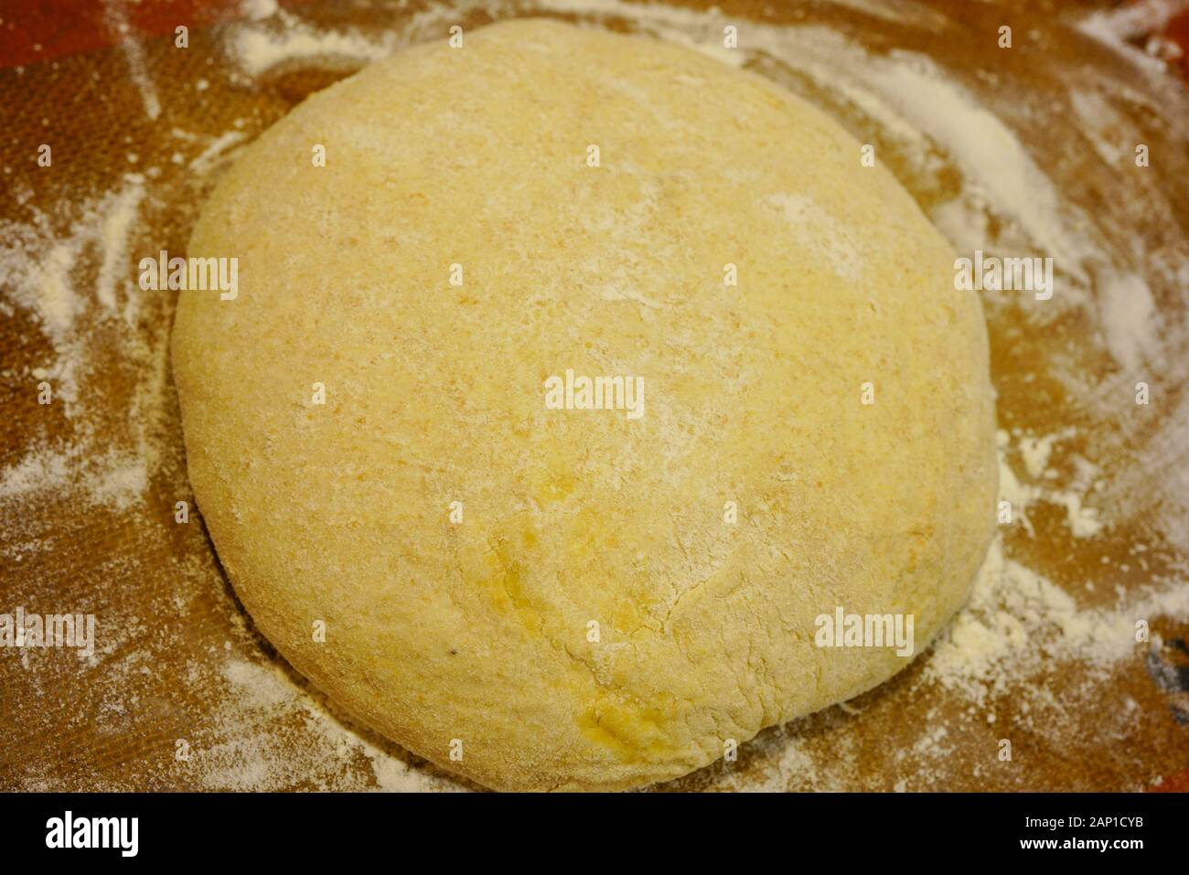 Making a ball with proofed yeast dough for miracle overnight no knead