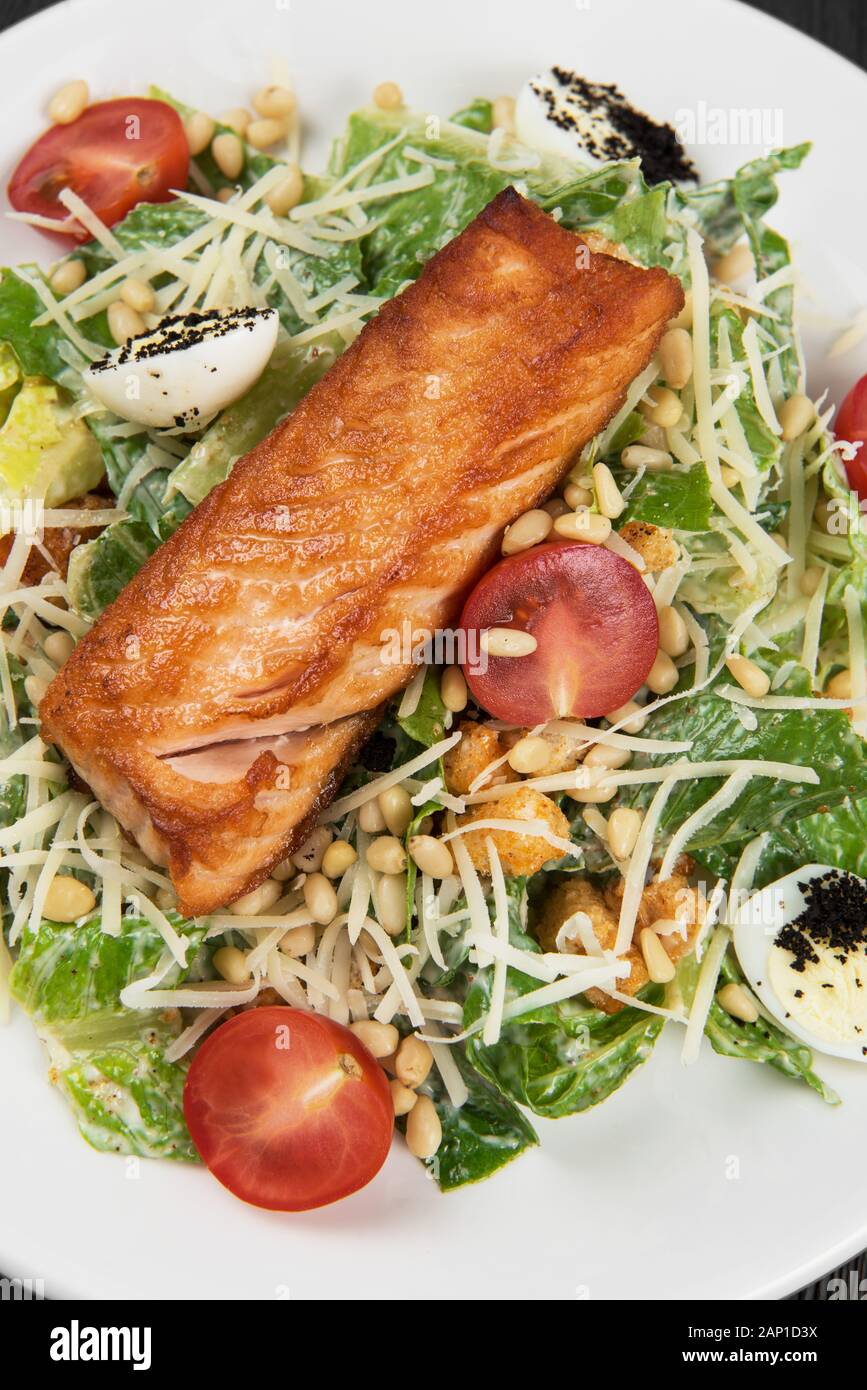 Grilled salmon caesar salad Stock Photo - Alamy