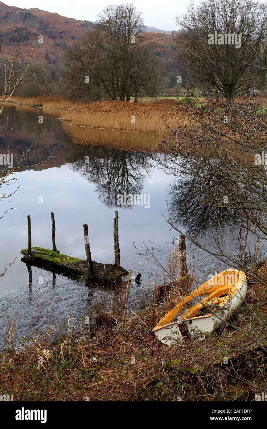 Rotten Jetty and flooded boat. Stock Photo