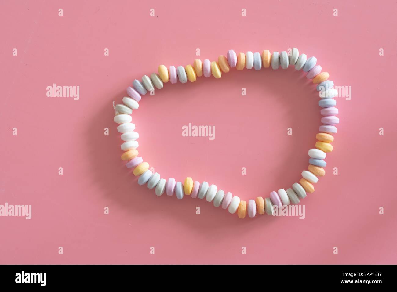 sweets Beads and bracelets candy on pink background Stock Photo - Alamy