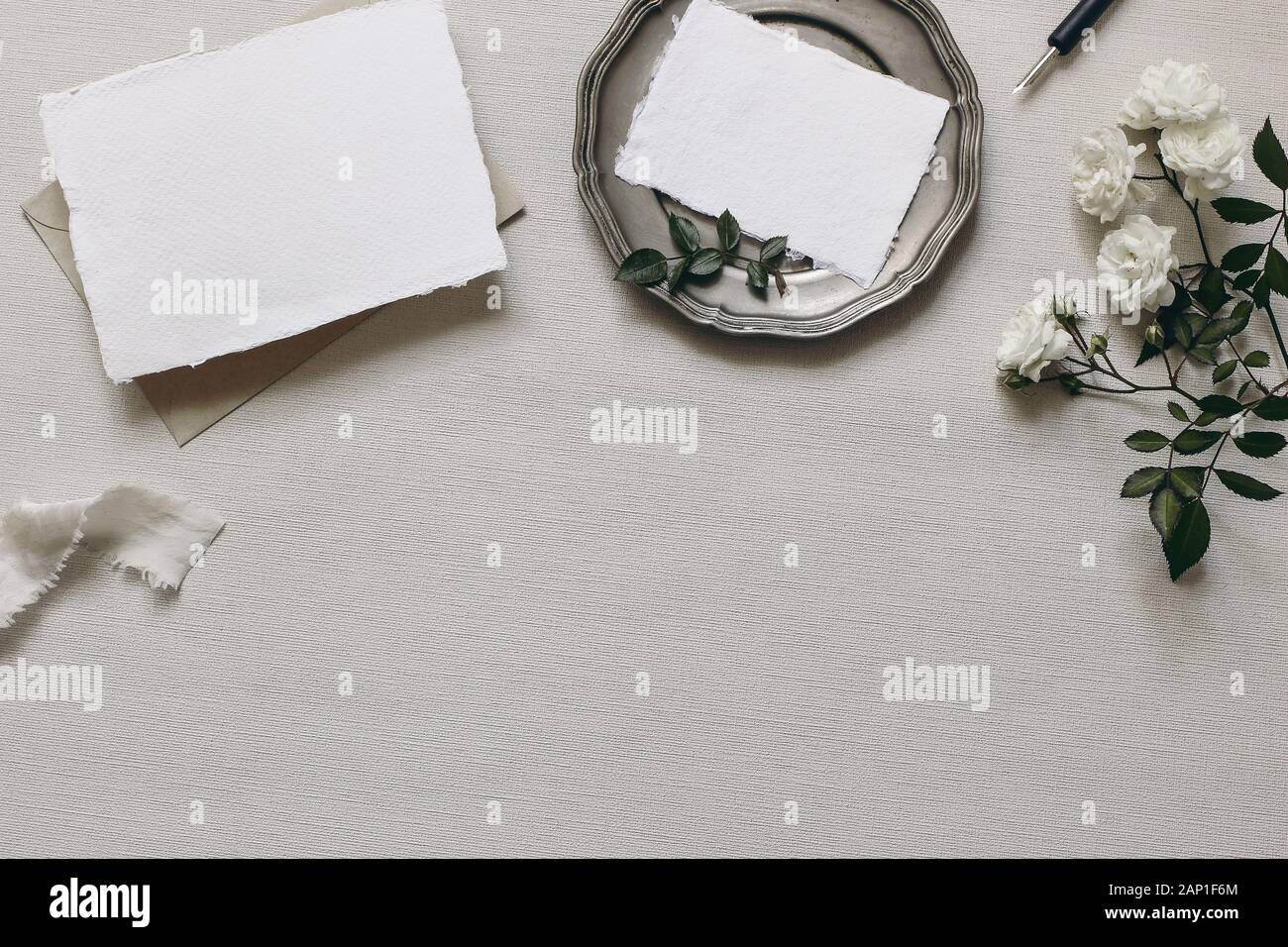 Download Stationery Wedding Table Mockup Scene Moody Composition With Fading White Rose Flowers Silver Plate Calligraphy Pen Blank Greeting Cards And Copy Stock Photo Alamy
