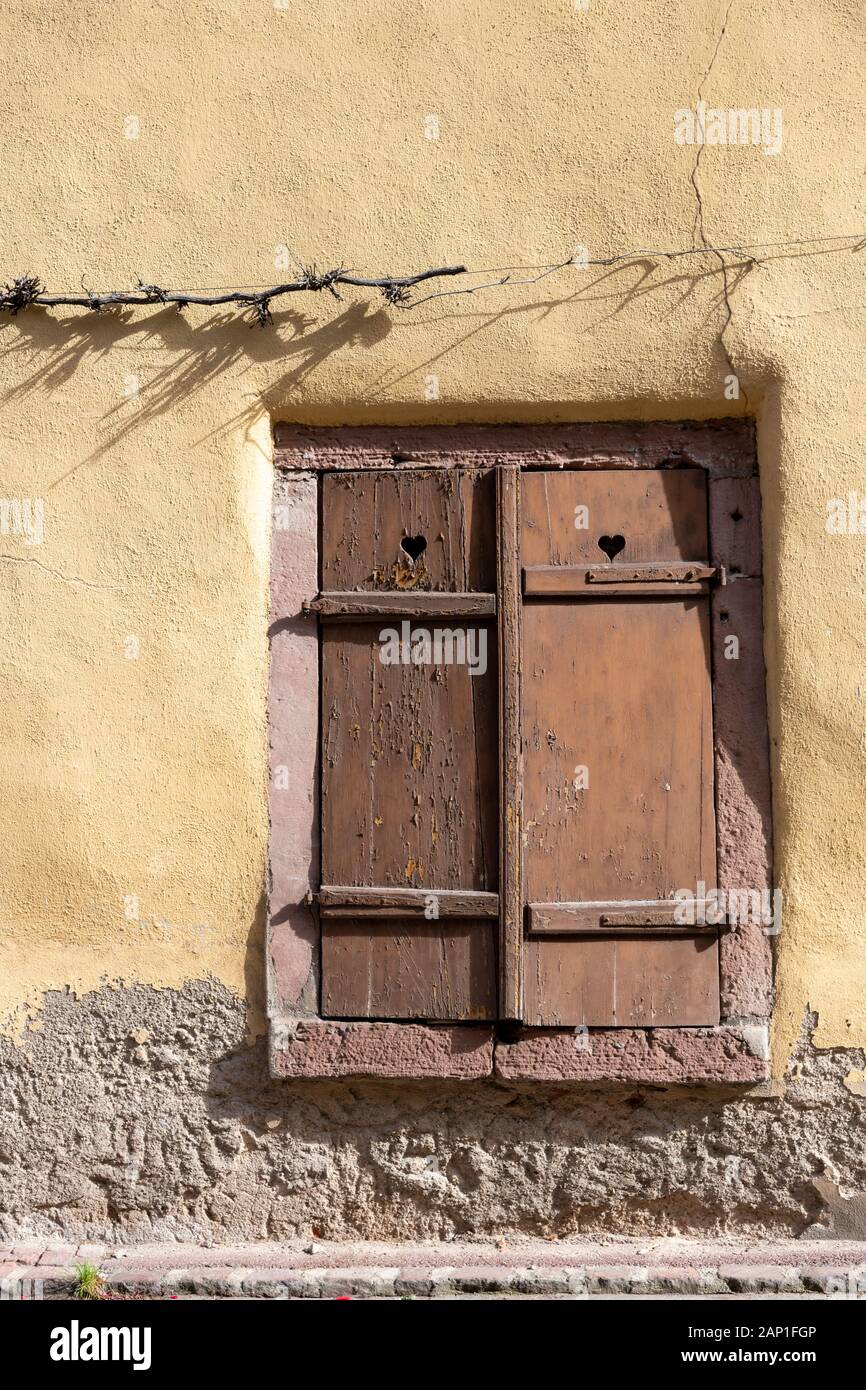 Pretty window with shutters on an old building in Alscae France Stock ...