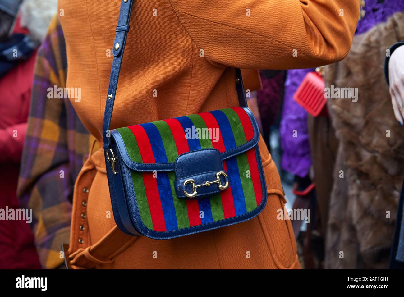 MILAN, ITALY - JANUARY 14, 2019: Woman with green, red and blue striped Gucci  bag before Gucci fashion show, Milan Fashion Week street style Stock Photo  - Alamy