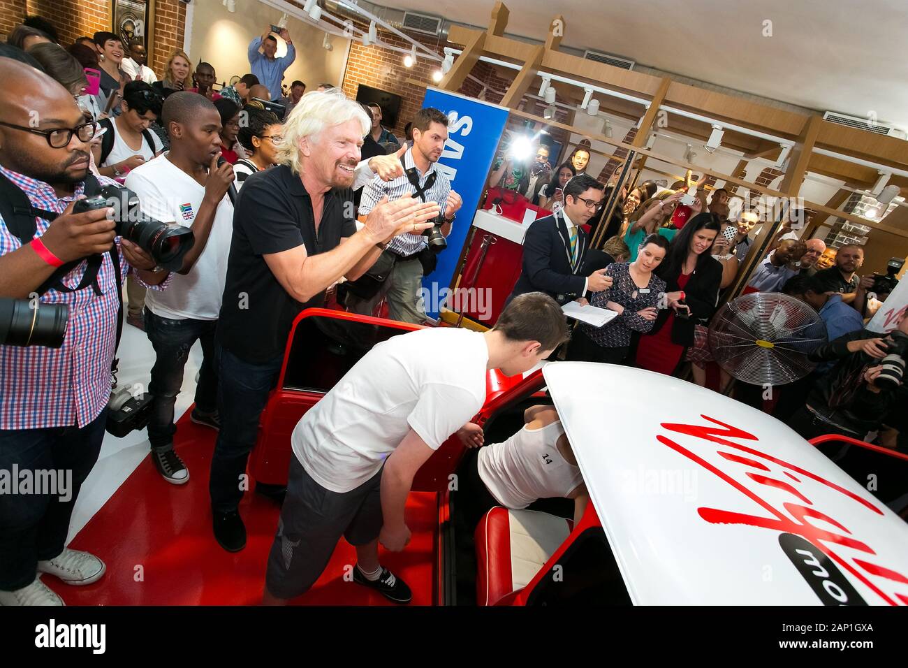 Johannesburg, South Africa - October 02, 2013: Richard Branson at Virgin Mobile Guinness World Record attempt and achieved fitting 25 people into a re Stock Photo