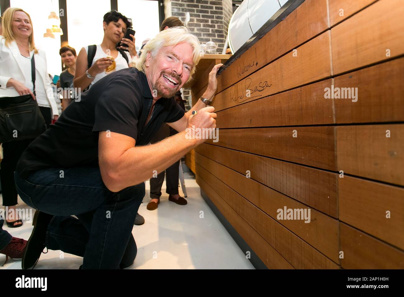 Johannesburg, South Africa - October 02, 2013: Richard Branson signing autographs at Virgin Mobile Guinness World Record attempt and achieved fitting Stock Photo