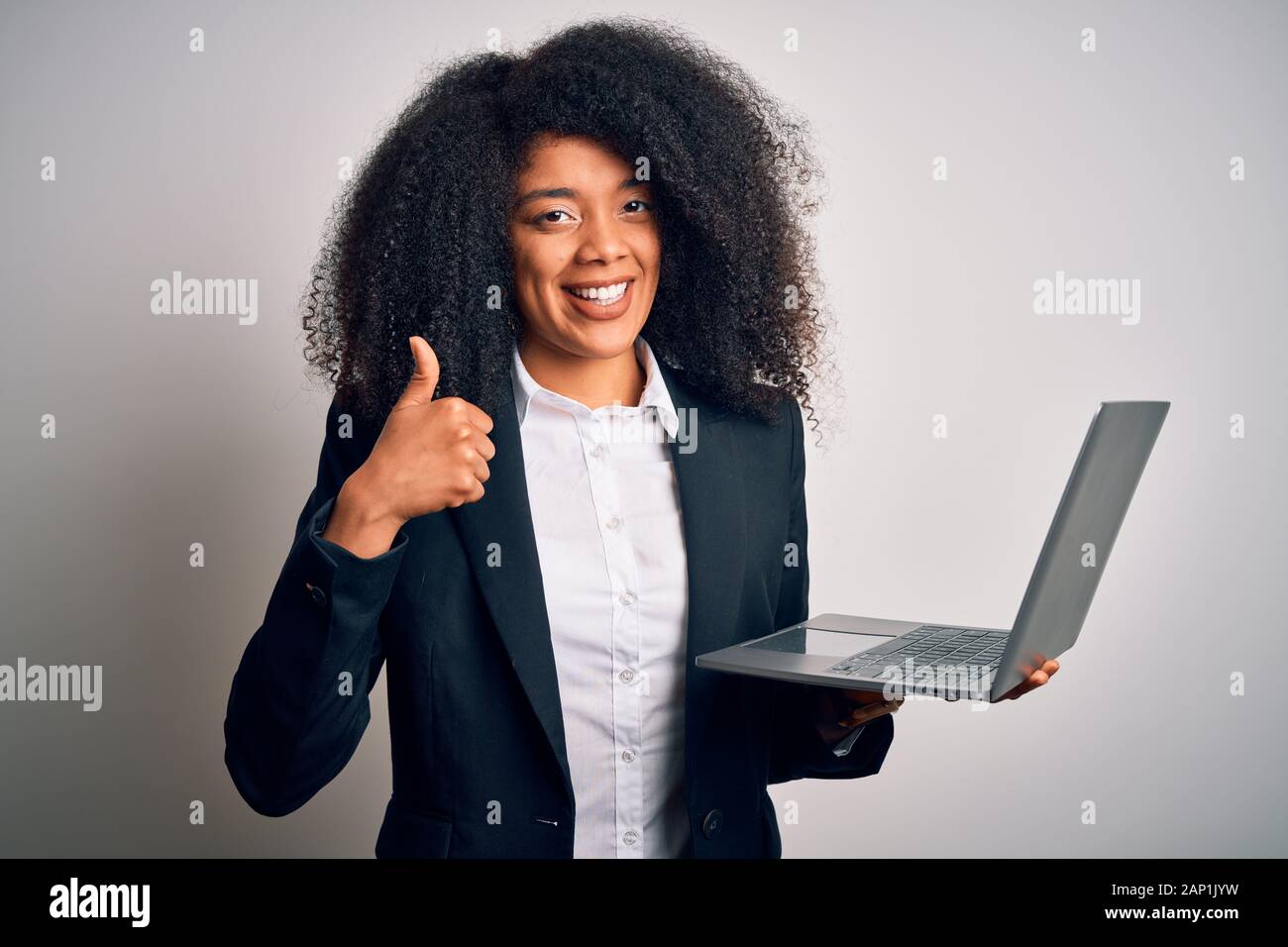 Young african american business woman with afro hair using computer ...