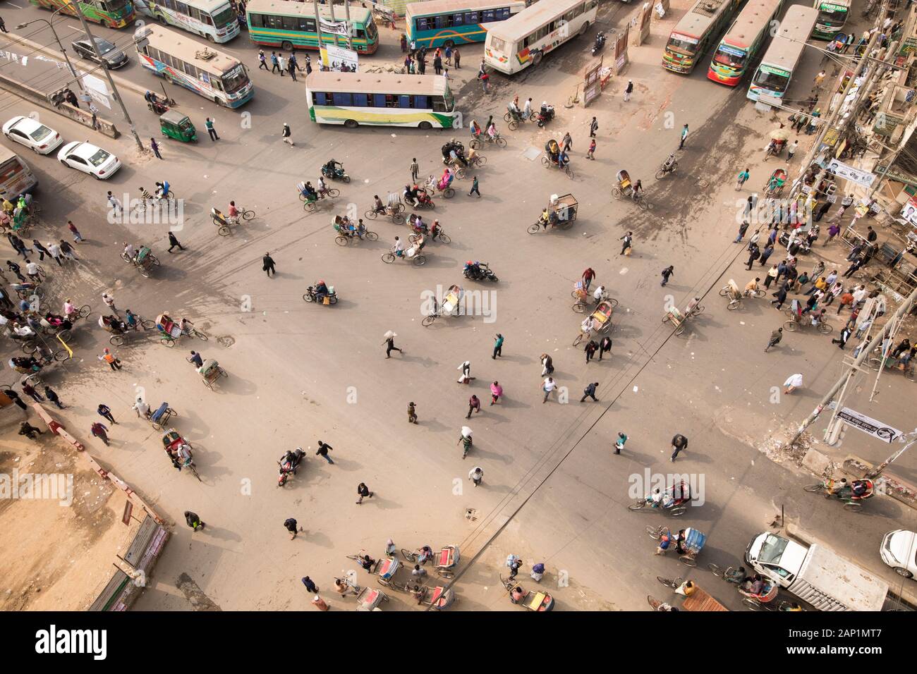 DHAKA, BANGLADESH - JANUARY 20, 2020 : People crosses the busy street. Stock Photo