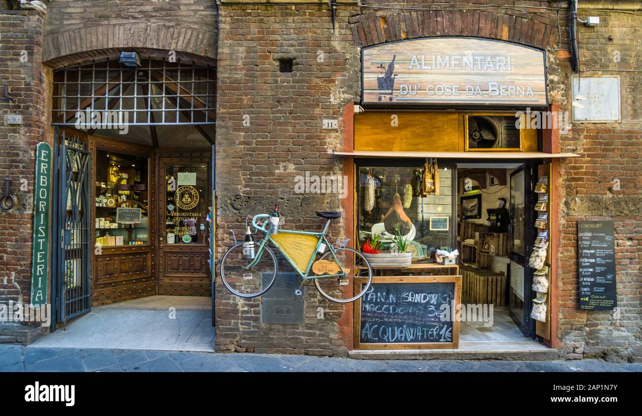 Herbalist's shop and delicatessen and sandwich sop in Via Diacceto in the hiostoric center of Siena, Tuscany, Italy Stock Photo