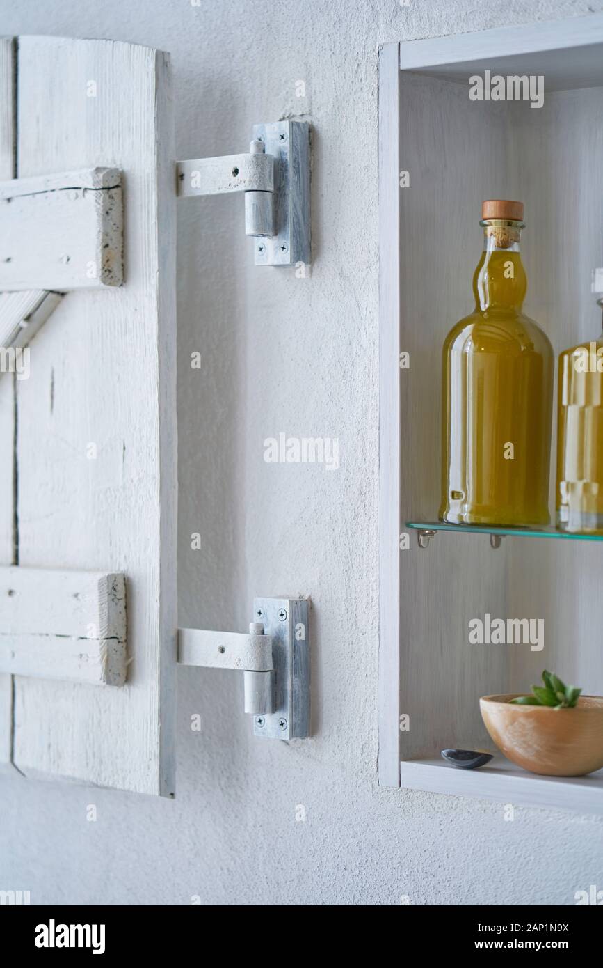 bottles olive oil oils closeup kitchen shelf detail food natural organic beauty home country house healthy stylish white bowl upright portrait format Stock Photo