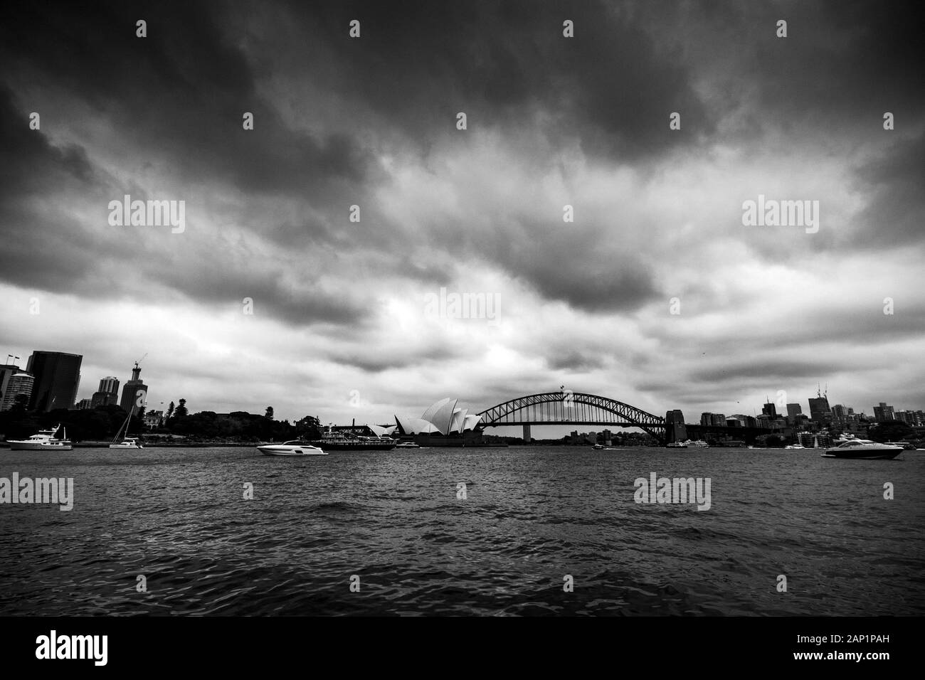 Moody skies over Sydney harbour as dusk falls Stock Photo