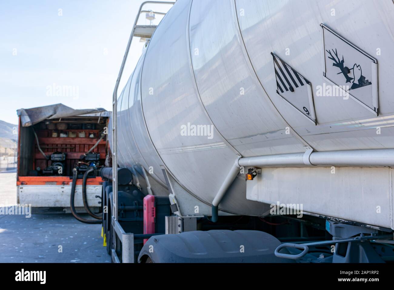 Fuel supply with tank truck to ship Stock Photo