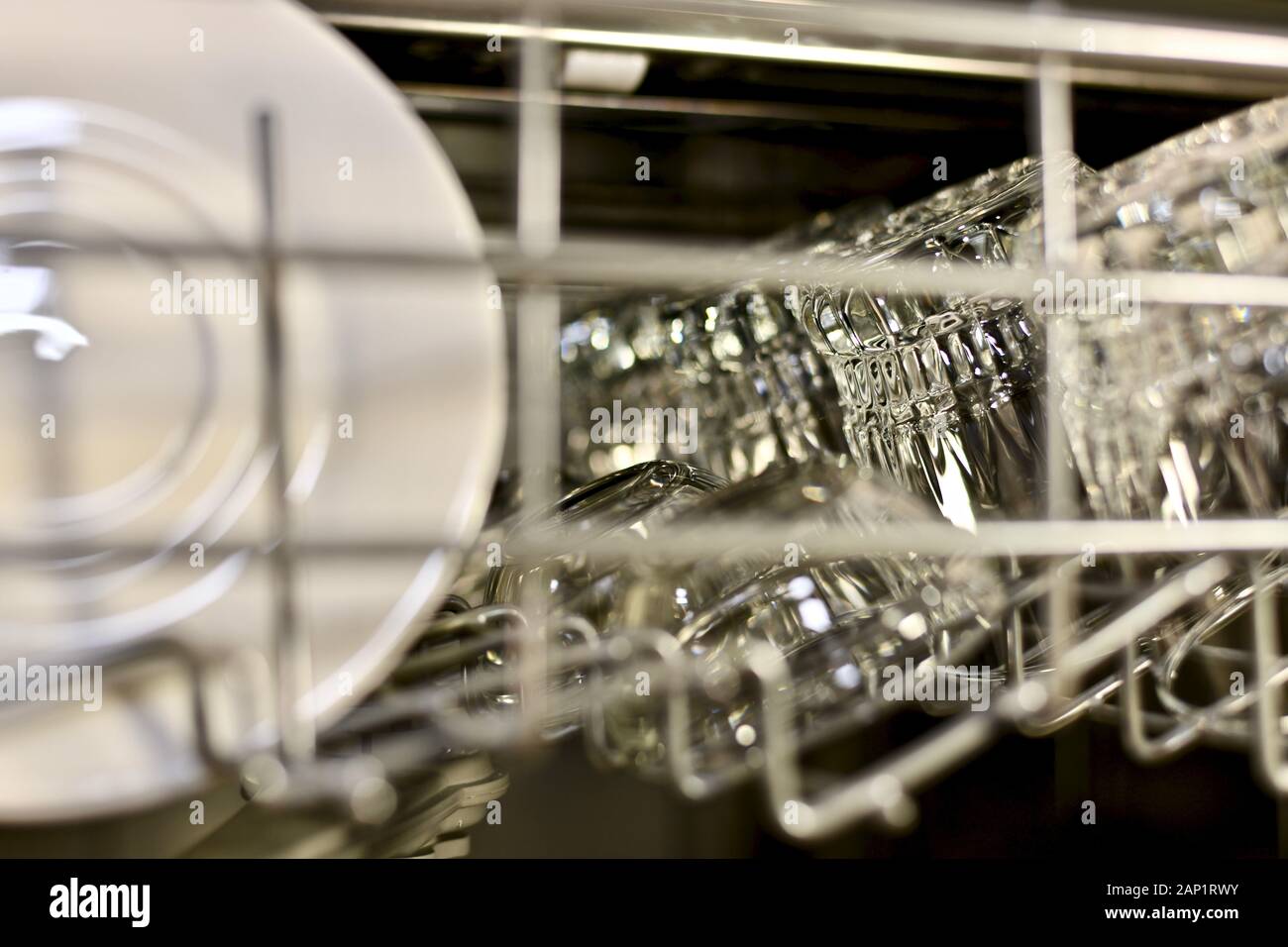 Pure utensils sparkle and shine on the top shelf of the dishwasher