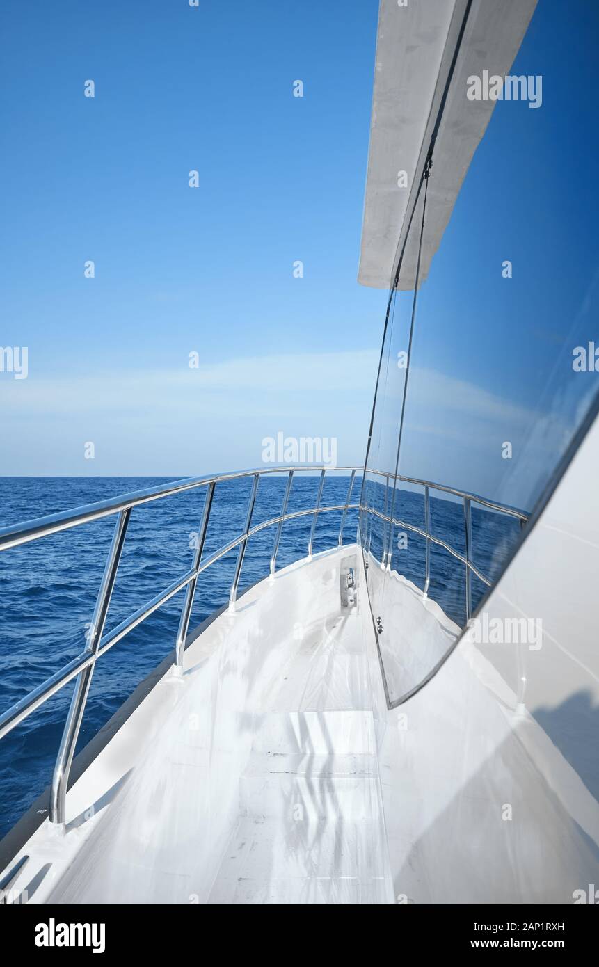 Modern boat side and railing on a sunny day, luxury travel concept. Stock Photo