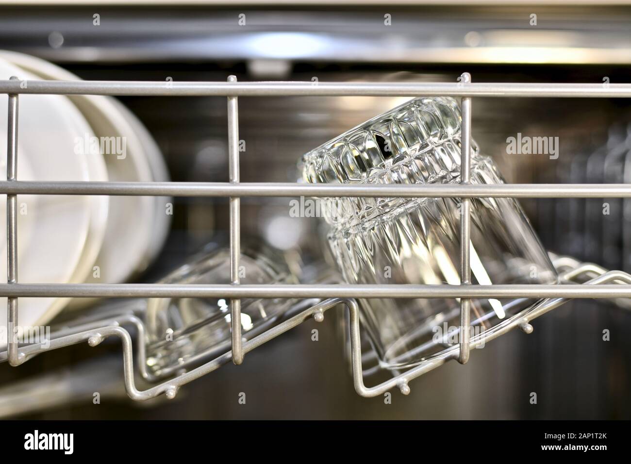 Pure utensils sparkle and shine on the top shelf of the dishwasher