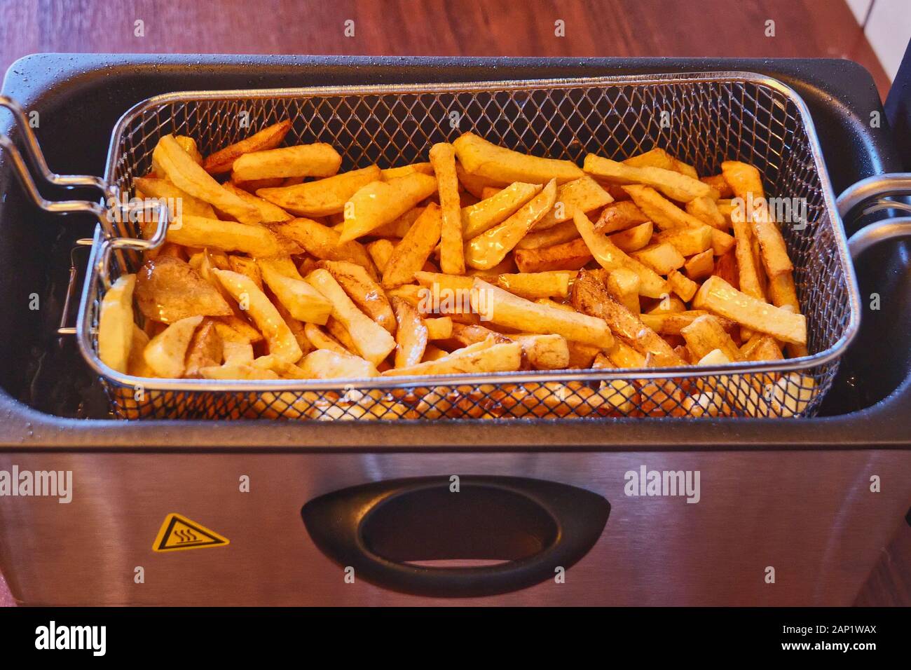 French Fries with Electric Friteuse Stock Photo - Alamy