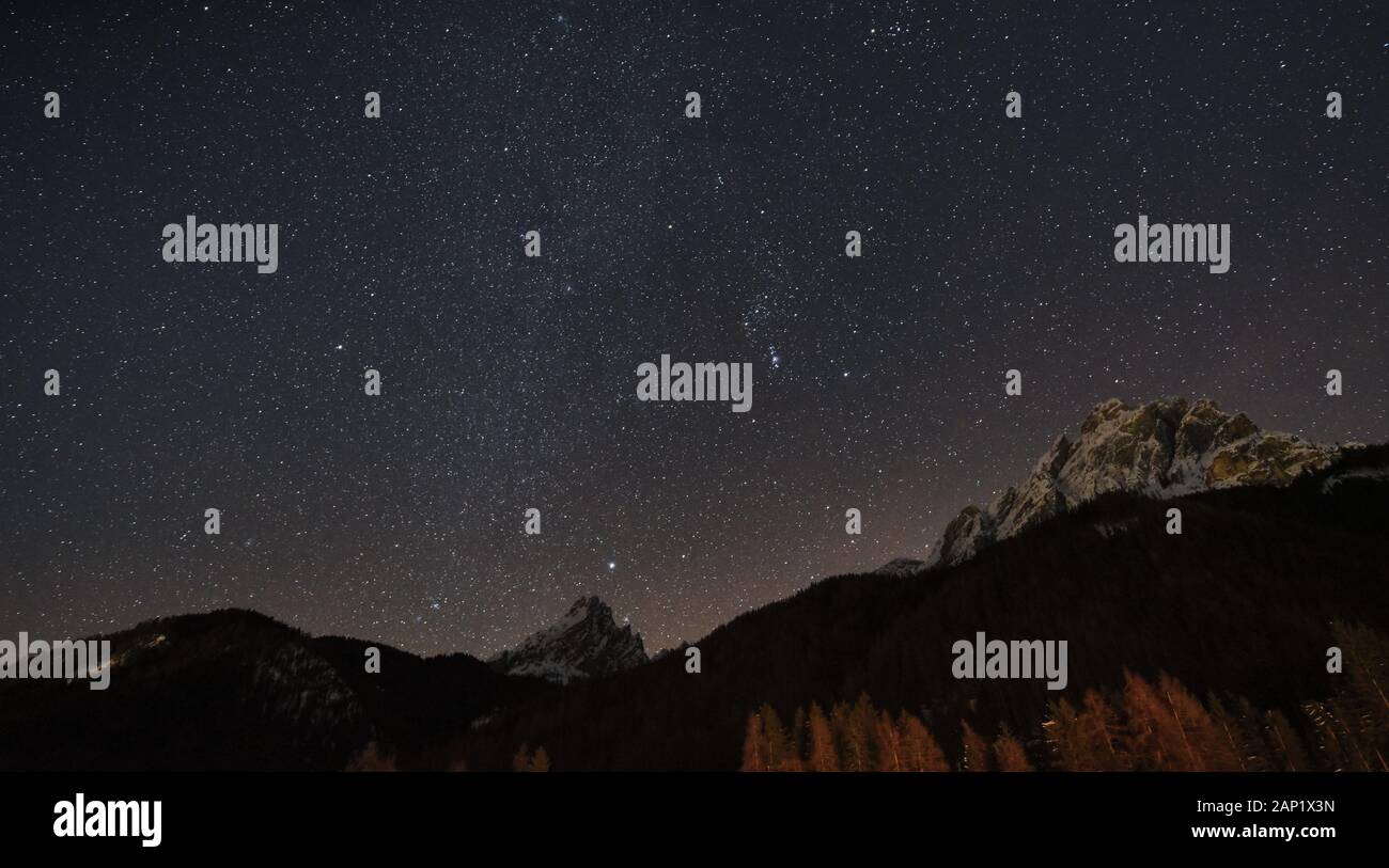 Starry winter sky over the Vallandro and Herrstein peak Stock Photo