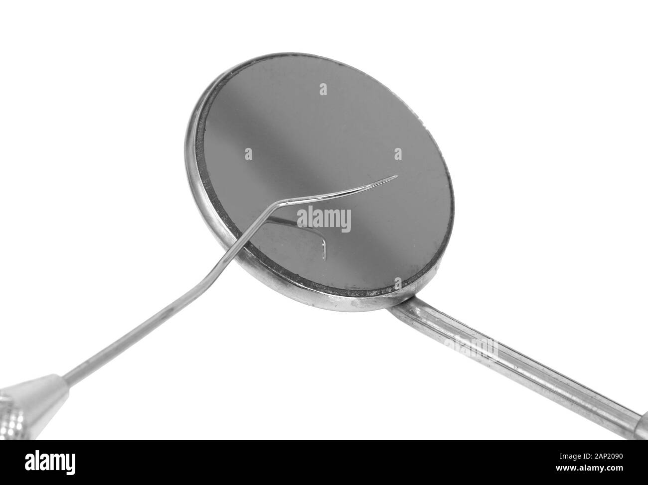 Mirror and dental tools on white Stock Photo Alamy