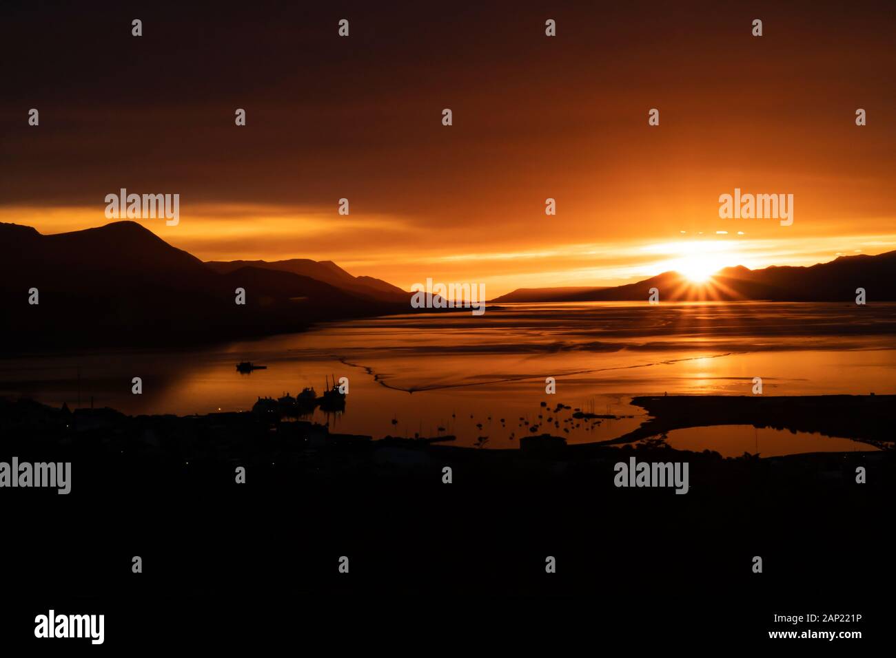 Sunset over the Bay of Ushuaia the southernmost city in the word and the capital of Tierra del Fuego, Antartida e Islas del Atlantico Sur Province, Ar Stock Photo