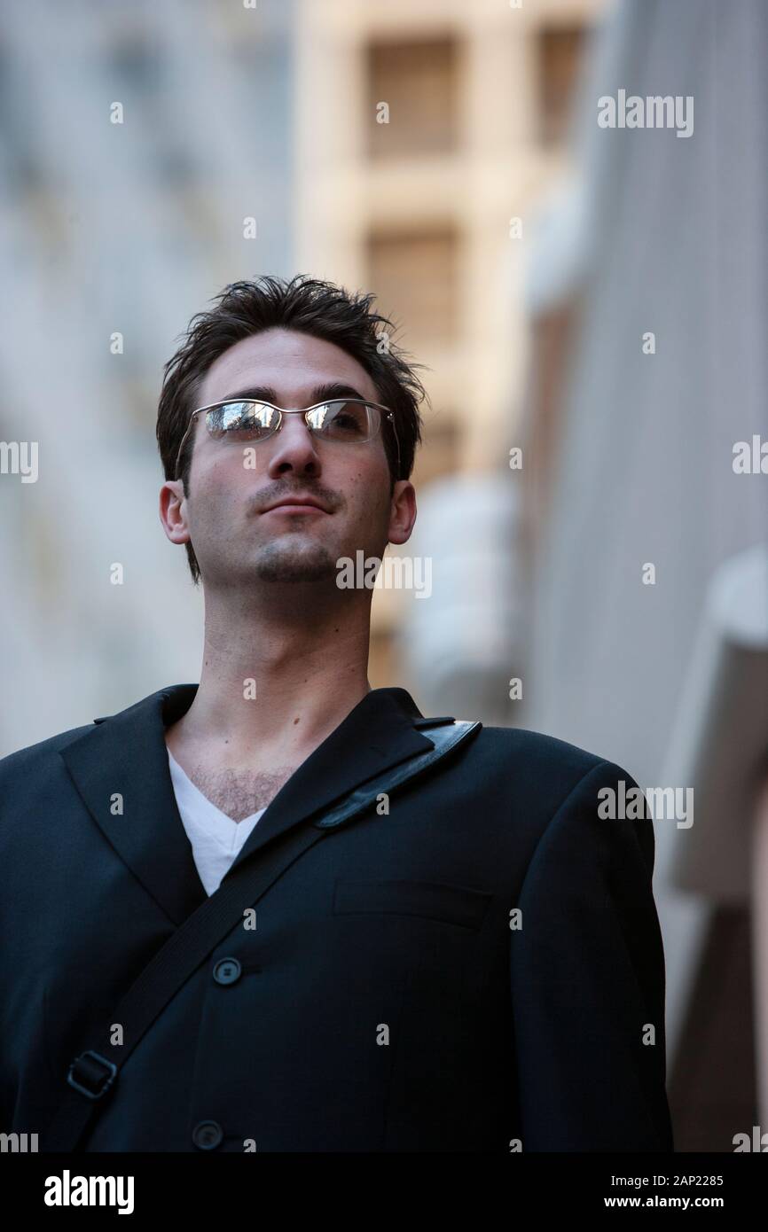 Portrait of a confident millennial man wearing sunglasses outdoors Stock Photo