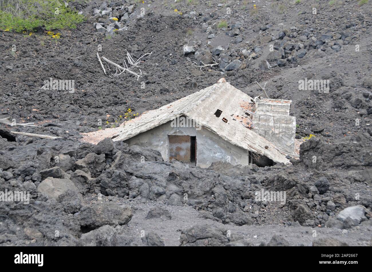 House buried under lava on the slopes of Mount Etna, Sicily, Italy