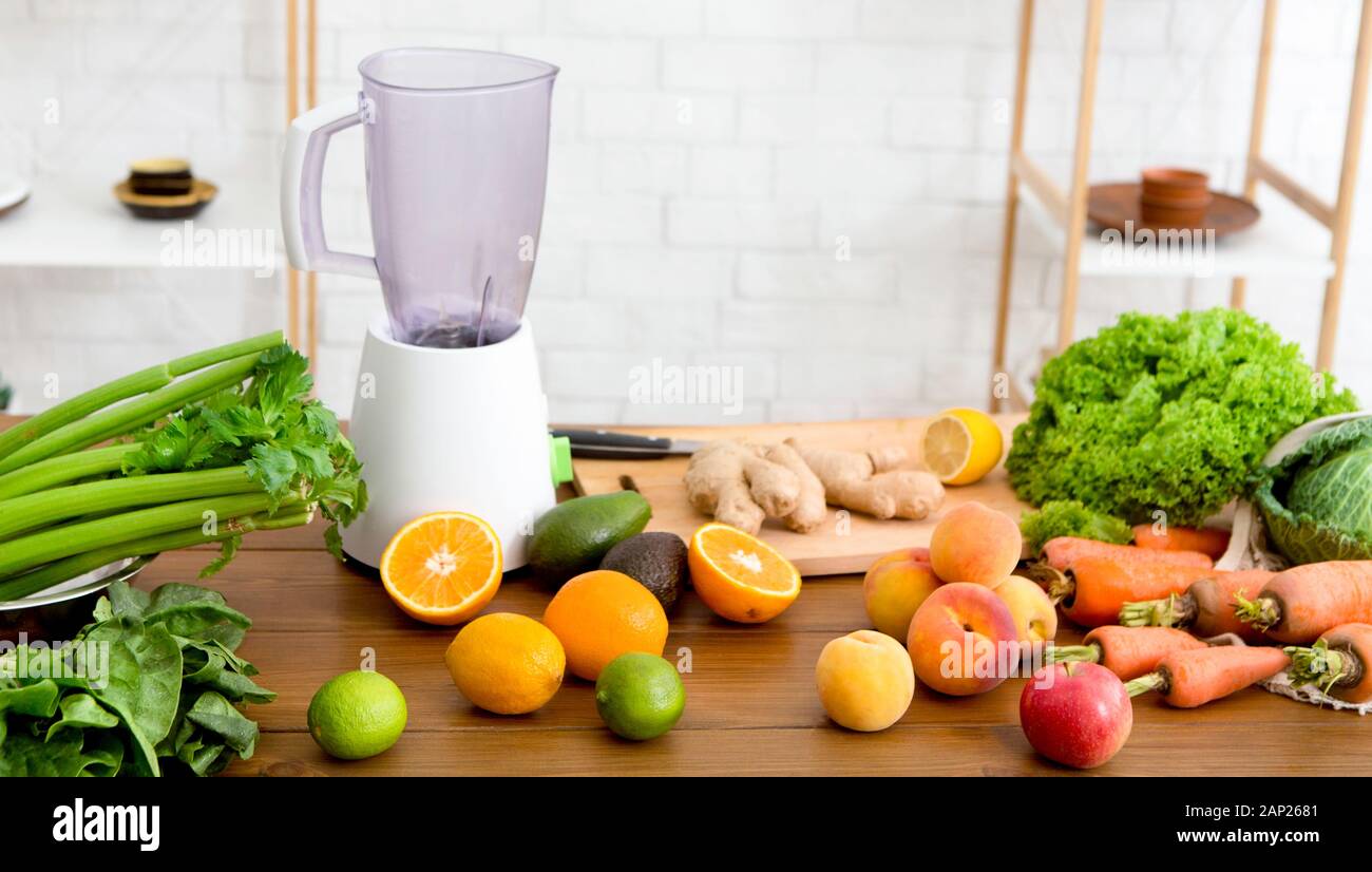 Blender jar and fresh fruits and vegetables on table at home Stock Photo -  Alamy
