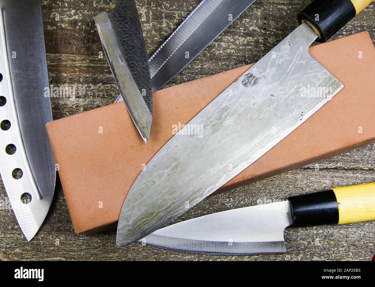 Grinding knifes: Close up of different metal japanese kitchen knifes with s...