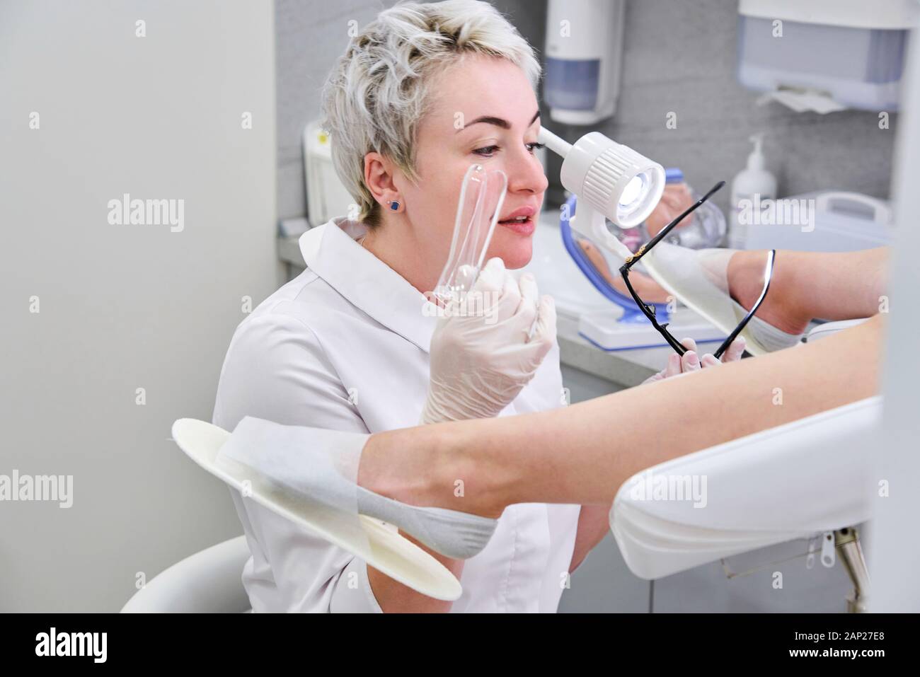 Female gynecologist with vaginal speculum in clinic Stock Photo Alamy