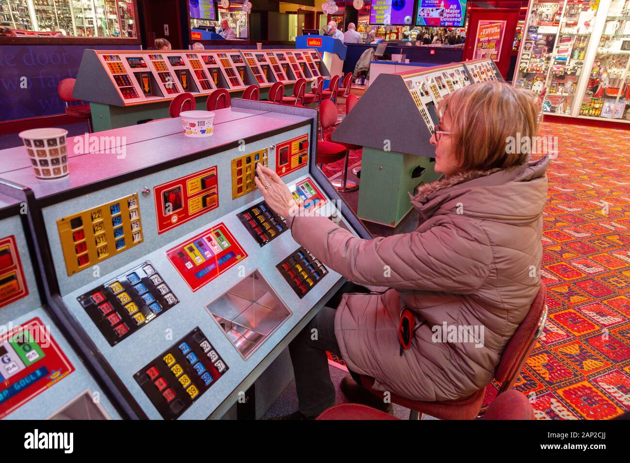 Bingo UK; a woman playing bingo, Skegness amusements, Skegness Lincolnshire UK Stock Photo