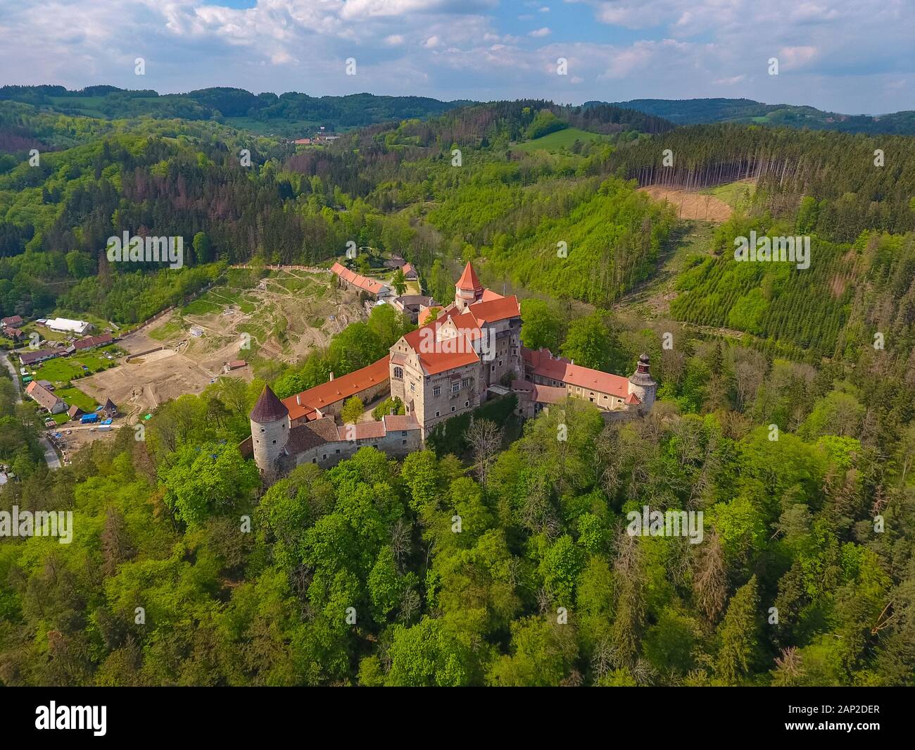 Aerial view of Moravian castle Pernstejn, standing on a hill above deep forests of the Bohemian-Moravian Highlands in Czech Republic Stock Photo